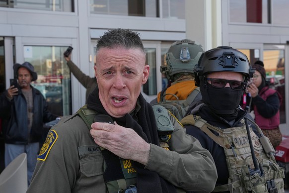 U.S. Border Patrol Cmdr. Gregory Bovino walks out of a Target store, Sunday, Jan. 11, 2026, in St. Paul, Minn. (AP Photo/Adam Gray)
Immigration Enforcement Minnesota