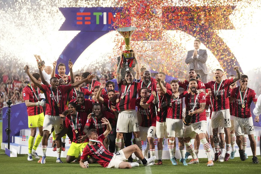 AC Milan&#039;s players celebrate after winning a Serie A soccer match between AC Milan and Sassuolo, in Reggio Emilia&#039;s Mapei Stadium, Italy, Sunday, May 22, 2022. AC Milan secured its first Ser ...