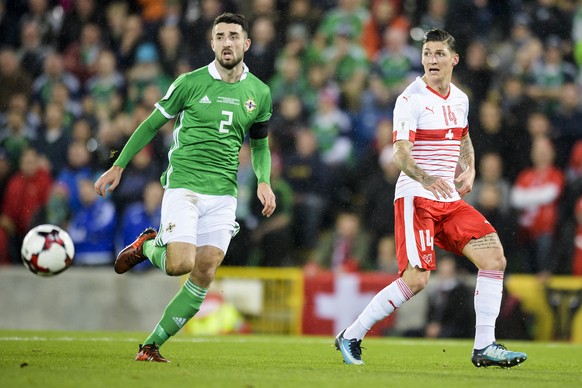 Northern Ireland&#039;s defender Conor McLaughlin, left, fights for the ball with Switzerland&#039;s midfielder Steven Zuber, right, during the 2018 Fifa World Cup play-offs first leg soccer match Nor ...