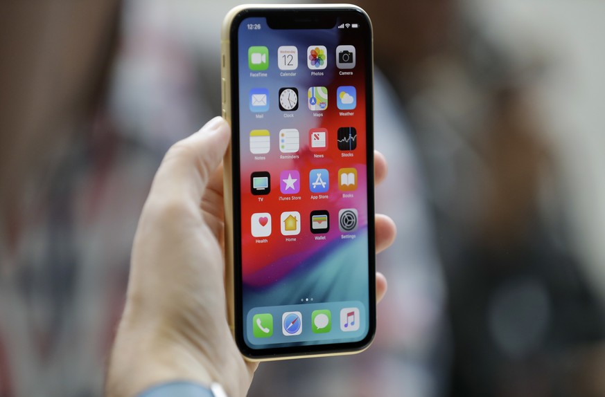 The new Apple iPhone XR is on display at the Steve Jobs Theater after an event to announce new products Wednesday, Sept. 12, 2018, in Cupertino, Calif. (AP Photo/Marcio Jose Sanchez)