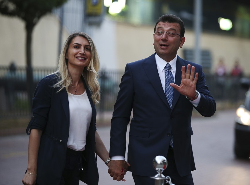 Istanbul&#039;s mayoral candidate Ekrem Imamoglu, candidate of the secular opposition Republican People&#039;s Party, or CHP, accompanied by his wife, name not given, arrives for a televised debate wi ...