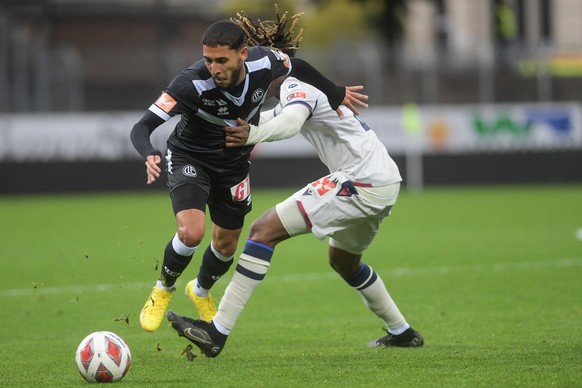 From left, Lugano&#039;s player Hicham Mahou and Basel&#039;s player Mamadou Kaly Sene, during the Super League soccer match FC Lugano against FC Basel, at the Cornaredo Stadium in Lugano, Sunday, Oct ...