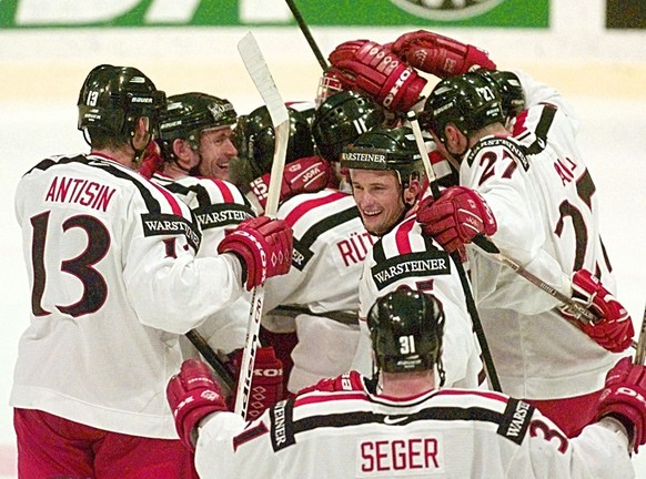 Switzerland&#039;s ice hockey national team celebrates their 4-2 victory against Russia during the Ice Hockey World Championships qualifying round at Basel&#039;s St.Jakobs hall in Switzerland, Thuesd ...