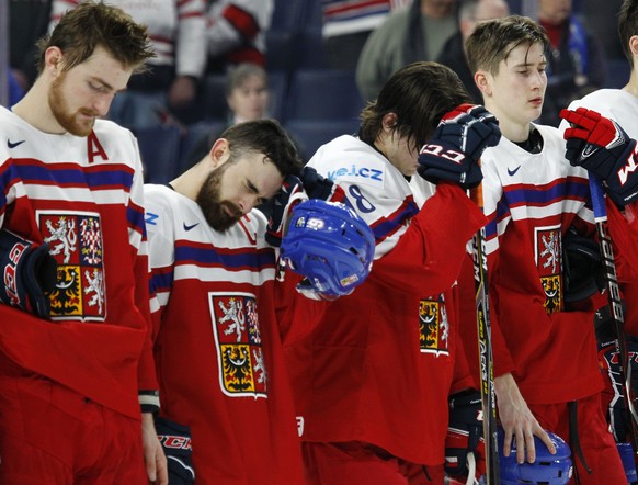 Czech Republic players react to a 9-3 loss to the United States in the third-place game of the IIHF world junior hockey championships, Friday, Jan. 5, 2018, in Buffalo, N.Y. (AP Photo/Jeffrey T. Barne ...