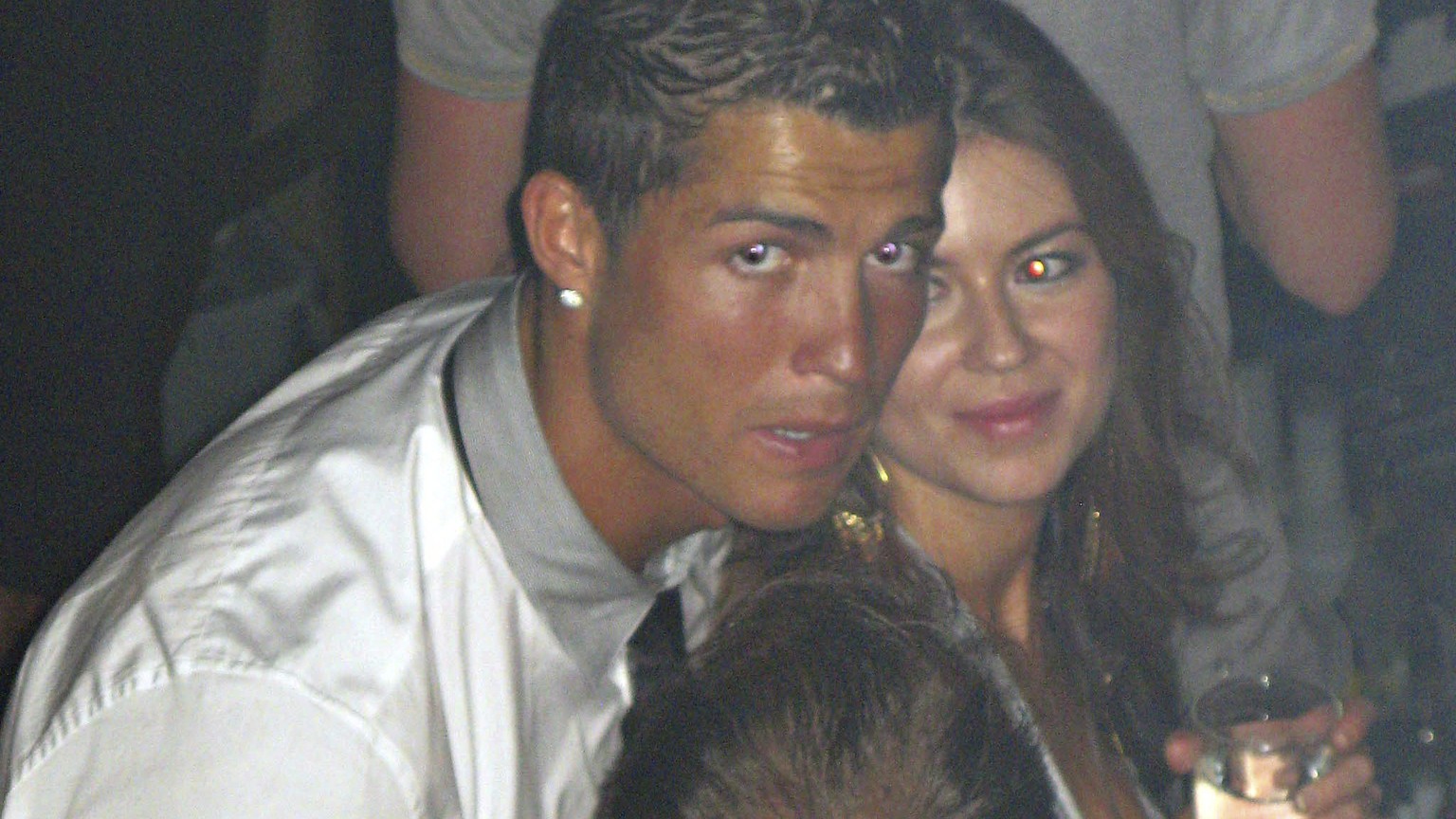 In this June 2009 photo made available to the Associated Press on Friday Oct. 5, 2018, soccer star Cristiano Ronaldo is pictured with Kathryn Mayorga in Rain Nightclub in Las Vegas. A lawyer for Mayor ...