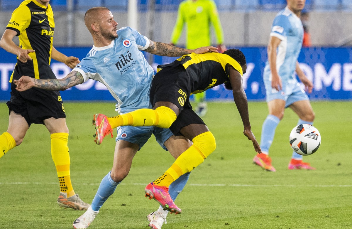 Slovan Bratislava's Vladimir Weiss duels for the ball with Young Boys Bern's Nicolas Ngamale, right, during the Champions League second qualifying round, first leg soccer match between Slova ...