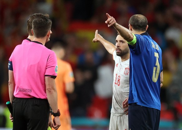 epa09327240 Giorgio Chiellini of Italy (R) reacts with Jordi Alba of Spain prior the penalty shoot out during the UEFA EURO 2020 semi final between Italy and Spain in London, Britain, 06 July 2021. EP ...