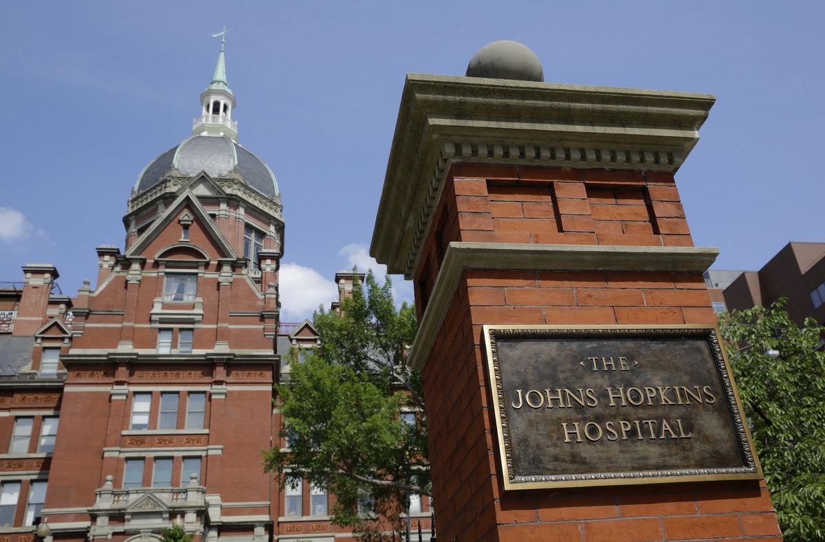 A sign stands in front of part of the Johns Hopkins Hospital complex, July 8, 2014, in Baltimore. Most medical students at Johns Hopkins University will no longer pay tuition thanks to a $1 billion gi ...