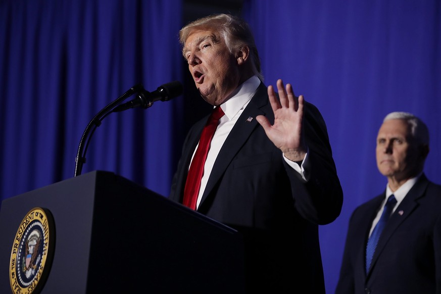 epa05750384 US President Donald J. Trump delivers remarks during a visit to the Department of Homeland Security with Vice President Mike Pence (R) in Washington, DC, USA, 25 January 2017. While at the ...