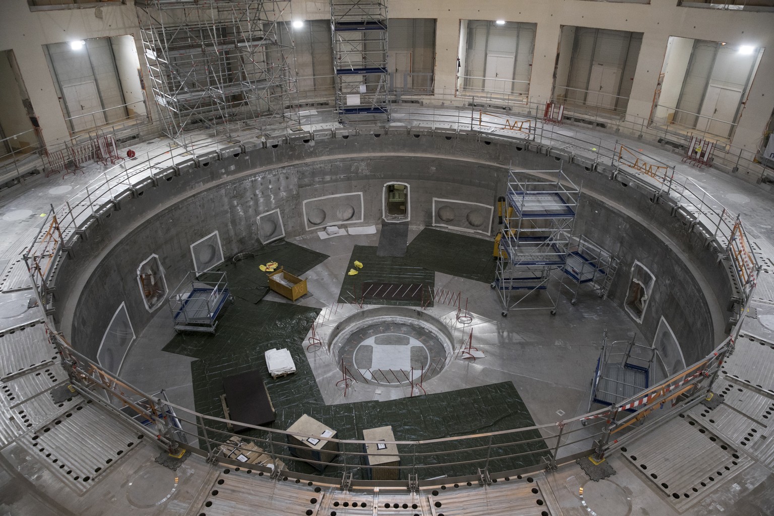 The base of the cryostat sits inside the bioshield of the ITER Tokamak in Saint-Paul-Lez-Durance, southern France, Tuesday, July 28, 2020. A project of daunting proportions and giant ambitions replica ...
