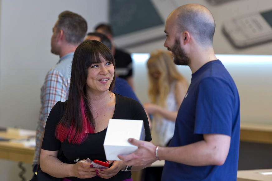 LONDON, ENGLAND - JUNE 17: Apple Watch customers shopping in Apple Regent St store on June 17, 2015 in London, England. The Apple Watch is available to reserve online and pick up in store in UK, Germa ...