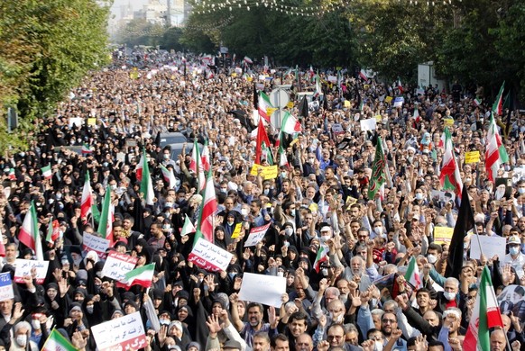 epa10271227 Thousands of Iranians take part during a pro-government rally against the recent terror attack and anti-government protests in Iran, after Friday&#039;s prayer in Tehran, Iran, 28 October  ...
