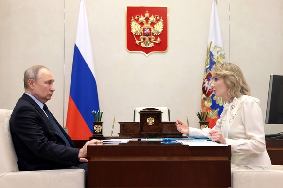 RUSSIA, MOSCOW REGION - FEBRUARY 16, 2023: Russia s President Vladimir Putin L and Maria Lvova-Belova, Presidential Commissioner for Children s Rights in Russia, meet at Novo-Ogaryovo residence. Mikha ...