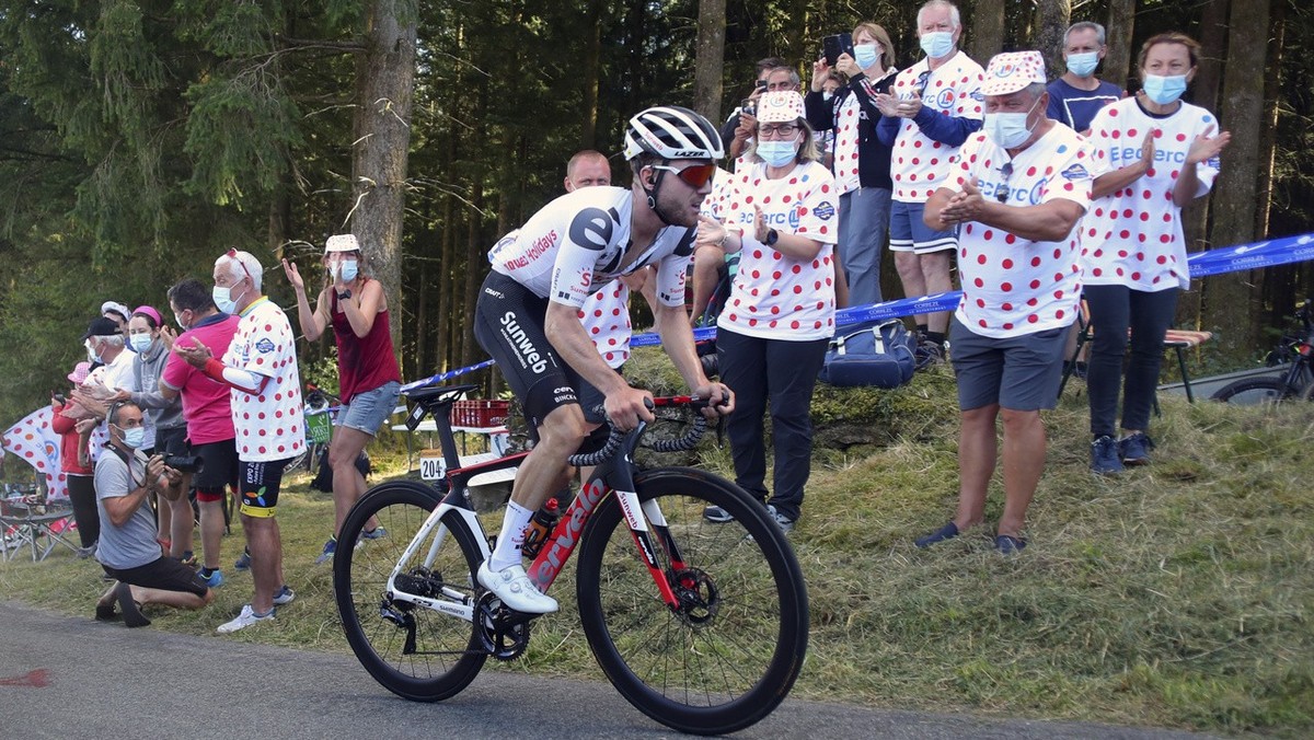 Spectators cheer Switzerland's Marc Hirschi as he climbs Suc au May pass during the stage 12 of the Tour de France cycling race over 218 kilometers from Chauvigny to Sarran, Thursday, Sept. 10, 2 ...