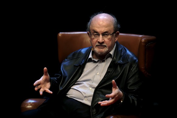 Author Salman Rushdie gestures during a news conference before the presentation of his latest book &#039;Two Years Eight Months and Twenty-Eight Nights&#039; at the Niemeyer Center in Aviles, northern ...