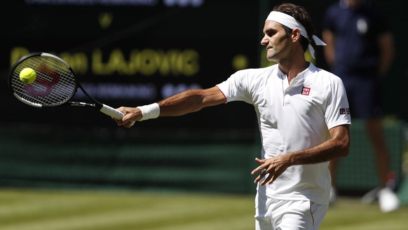 epa06857832 Roger Federer of Switzerland returns to Dusan Lajovic of Serbia in their first round match during the Wimbledon Championships at the All England Lawn Tennis Club, in London, Britain, 02 Ju ...