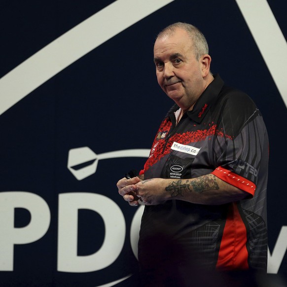 Britain&#039;s Phil Taylor in action during day ten of the World Darts Championship at Alexandra Palace, London, Saturday, Dec. 23, 2017. (Steven Paston/PA via AP)