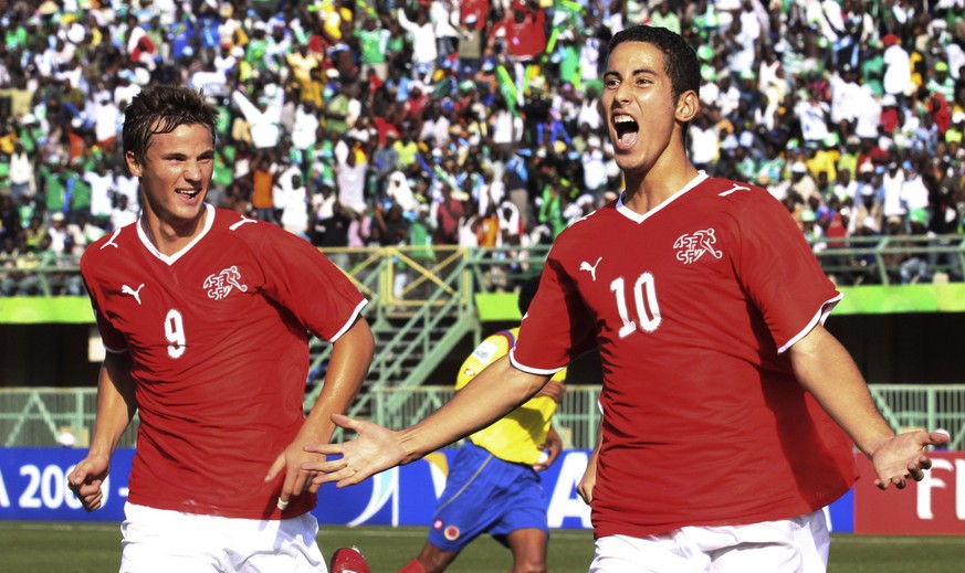 Switzerland&#039;s Nassim Ben Khalifa, right, reacts with fellow team member Haris Seferovic, left, after scoring on a penalty kick against Colombia during their Under-17 World Cup semifinal soccer ma ...