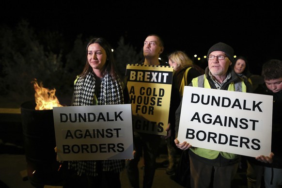 Protesters from the Border Communities Against Brexit group hold a demonstration on the Irish border on the Republic of Ireland side close to the town of Jonesborough, Ireland, Wednesday, Oct. 16 , 20 ...