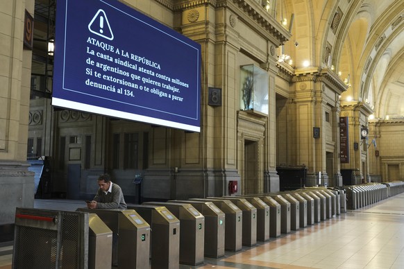 A lone worker stands at the turnstiles of the Consititucion train station during a general strike in Buenos Aires, Argentina, Thursday, April 10, 2025. (AP Photo/Rordigo Abd)
Argentina Strike