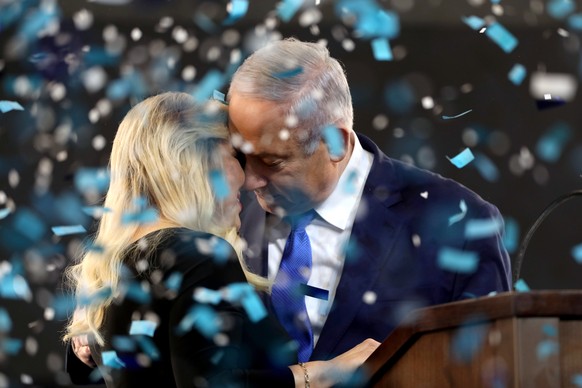 epa07495388 Israel&#039;s Prime Minister Benjamin Netanyahu (R) and his wife Sarah (L) celebrate following the election in Tel Aviv, Israel, early 10 April 2019. Television predictions gave both Benja ...