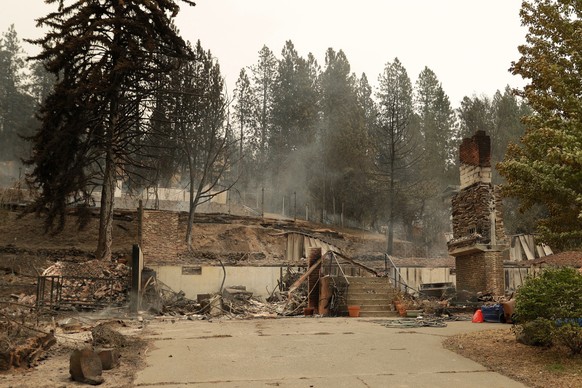 A structure that burned down is in ruins on W. Indian Trail Rd. in the aftermath of a wildfire in Spokane, Wash., Sunday, Aug. 2, 2026. (AP Photo/Young Kwak)
Western Wildfires