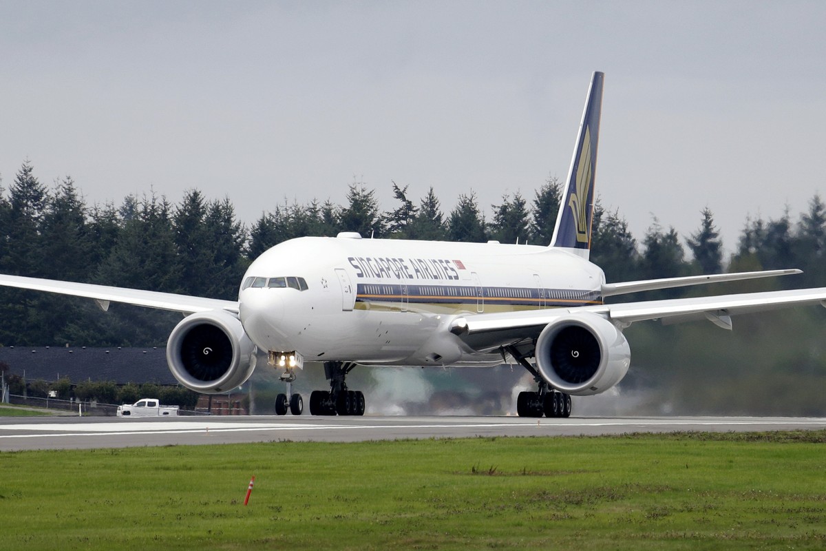 A Singapore Airlines Boeing 777-312ER readies to take off from Paine Field Tuesday, Sept. 17, 2013, in Everett, Wash. Singapore Airlines said on Tuesday, May 21, 2024, a person died aboard and others  ...