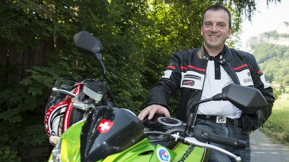 Walter Wobmann, member of the National Council and president of Swiss Moto FMS, takes part in a convention with his motorcycle, in Trimbach, Switzerland, on July 2, 2015. (KEYSTONE/Peter Schneider)

W ...