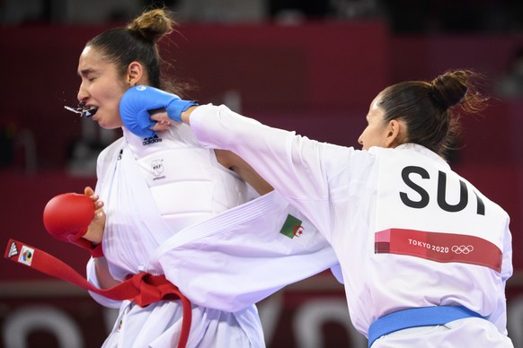 Elena Quirici, right, of Switzerland competes in the women&#039;s karate kumite +61kg fight against Lamya Matoub of Algeria at the 2020 Tokyo Summer Olympics in Tokyo, Japan, on Saturday, August 07, 2 ...