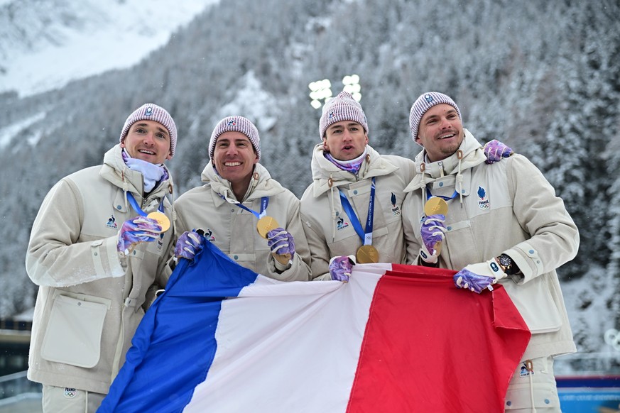 epa12750491 Gold medalist team France Eric Perrot, Emilien Jacquelin, Fabien Claude and Quentin Fillon Maillet pose during the award ceremony for the Men's 4x7.5km Relay of the Biathlon competiti ...