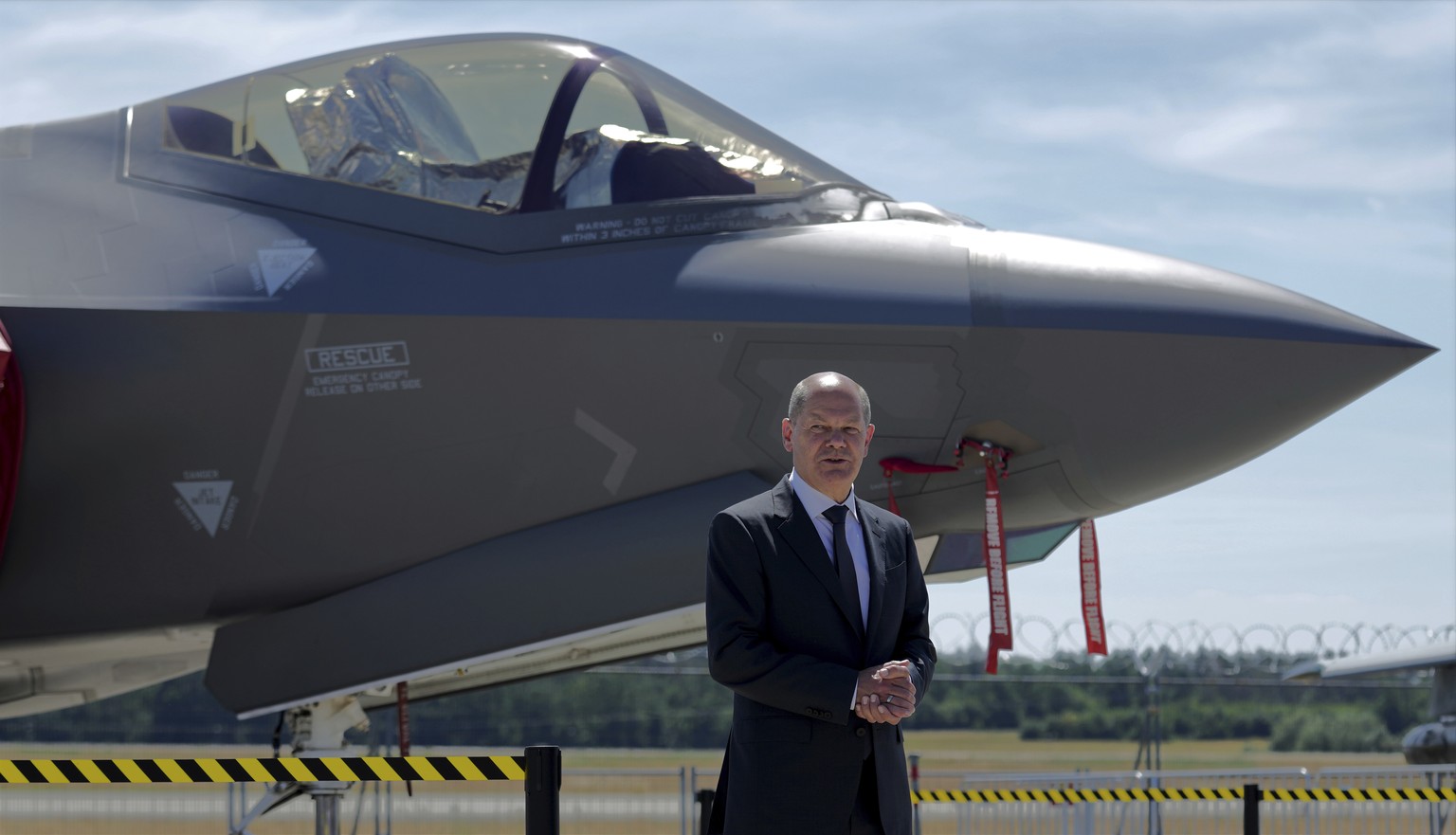 German Chancellor Olaf Scholz stands in front of a Lockheed Martin F-35 Lightning II airplaine during his visit at the ILA Berlin Air Show in Schoenefeld near Berlin, Germany, Wednesday, June 22, 2022 ...