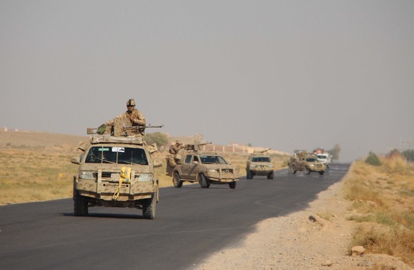 epa08740268 Afghan security officials patrol on Helmand-Kandahar highway after Taliban launched first large-scale attack on the capital of southwestern Helmand province in Afghanistan since the signin ...