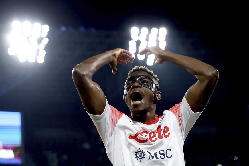 Napoli&#039;s Victor Osimhen celebrates, during the Serie A soccer match between Napoli and Cremonese at the Diego Armando Maradona stadium in Naples, Italy, Sunday, Feb. 12, 2023. (Alessandro Garofal ...