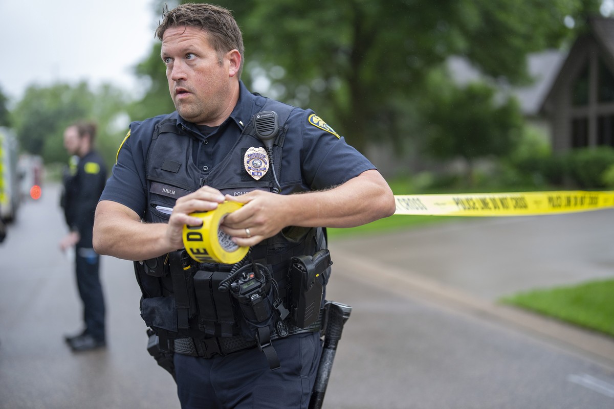 Brooklyn Park Police Lieutenant Hjelm sets up a perimeter with police tape near the scene of a shooting in Brooklyn Park, Minn. on Saturday, June 14, 2025. (Alex Kormann/Star Tribune via AP)
Minnesota ...