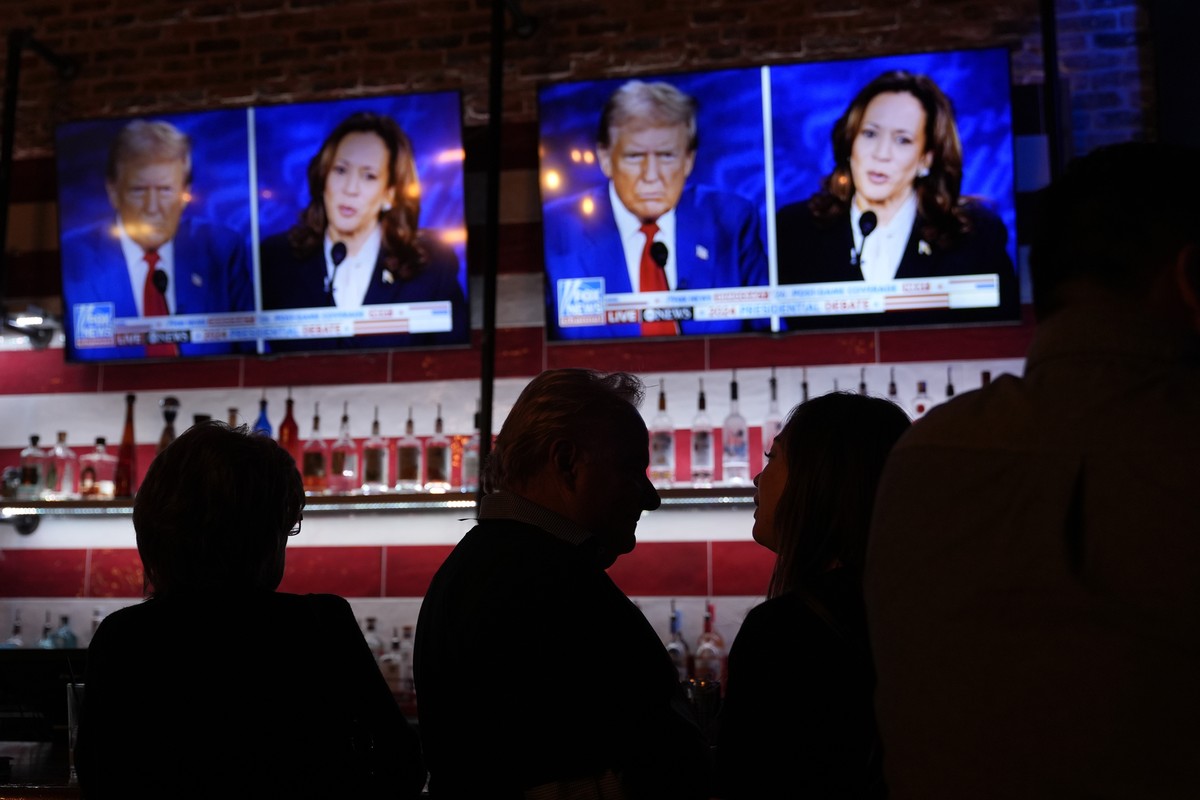 Viewers gather to watch a debate between Democratic presidential nominee Vice President Kamala Harris and Republican presidential nominee former President Donald Trump at the Angry Elephant Bar and Gr ...
