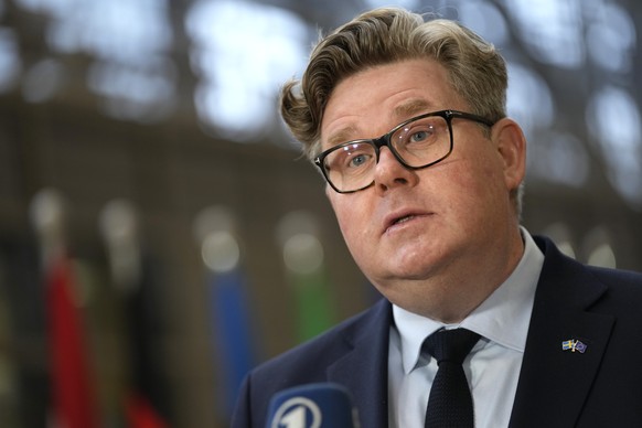Swedish Justice Minister Gunnar Strommer speaks with the media as he arrives for a meeting of EU interior ministers at the European Council Brussels on Thursday, March 9, 2023. European Union interior ...
