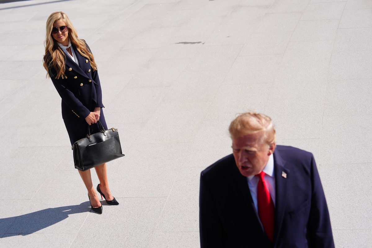 KEYPIX - President Donald Trump speaks to the reporters as he walks to board Marine One on the South Lawn of the White House, Tuesday, Oct. 13, 2026, in Washington, as White House press secretary Kati ...