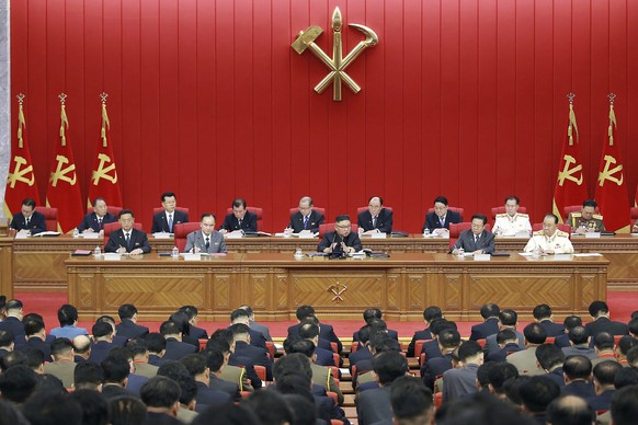 In this photo provided by the North Korean government, North Korean leader Kim Jong Un, center, speaks during a Workers&#039; Party meeting in Pyongyang, North Korea, Tuesday, June 15, 2021. Kim warne ...