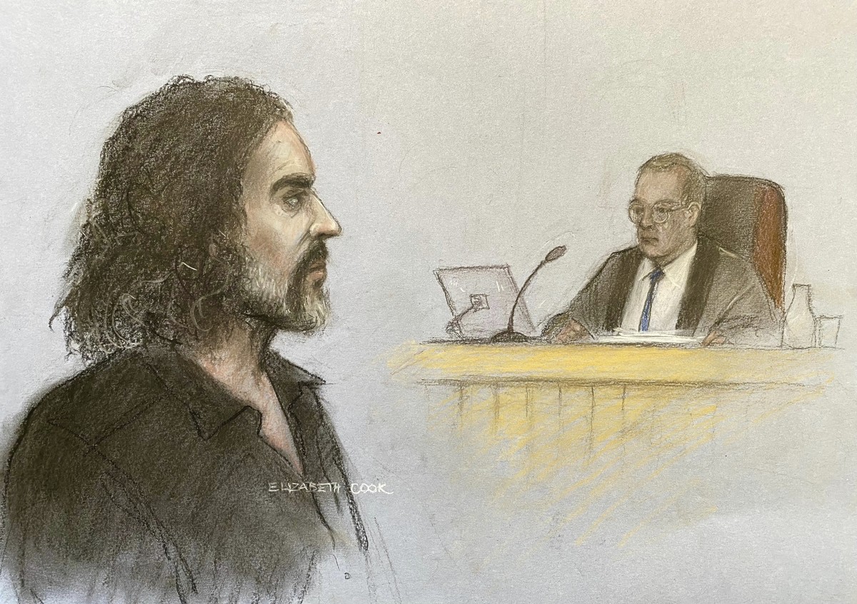 This court artist drawing by Elizabeth Cook shows Russell Brand appearing in the dock at Westminster Magistrates' Court, London, Friday, May 2, 2025, where he is charged with with one count each  ...