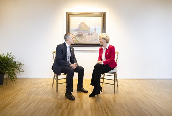 Swiss President Ignazio Cassis, Minister of Foreign Affairs, left, speaks to Ursula Von der Leyen, President of the European Commission, during the Ukraine Recovery Conference URC, Monday, July 4, 202 ...