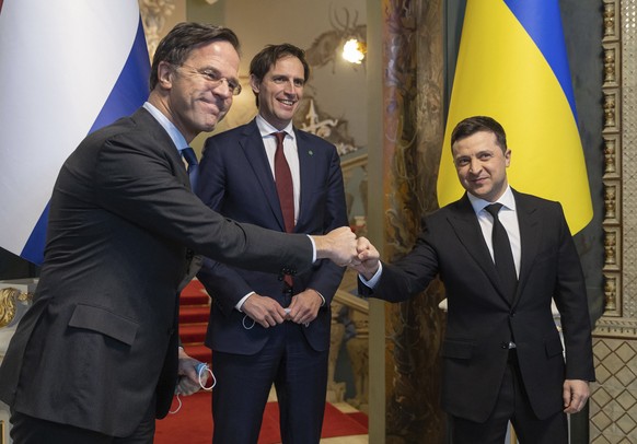 In this photo provided by the Ukrainian Presidential Press Office, Ukrainian President Volodymyr Zelenskyy, right, welcomes the Prime Minister of the Netherlands, Mark Rutte, left, in Kyiv, Ukraine, W ...