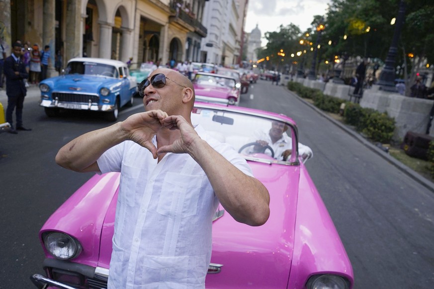 FILE - In this May 3, 2016, file photo, U.S. Actor Vin Diesel flashes a heart-in-hand to the crowd ahead of the presentation of fashion designer Karl Lagerfeld&#039;s &quot;cruise&quot; line for fashi ...