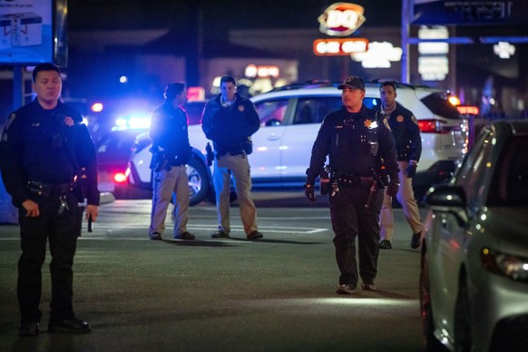 First responders walk through a parking lot near the scene of a mass shooting Saturday, Nov. 29, 2025, in Stockton, Calif. (AP Photo/Ethan Swope)
California Shooting