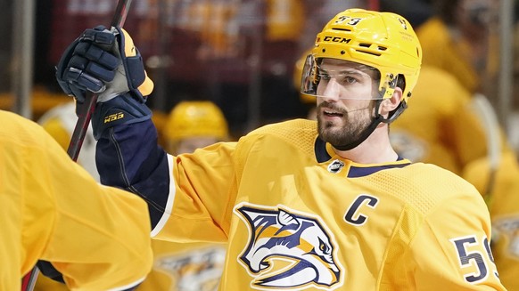 Nashville Predators defenseman Roman Josi (59) celebrates with Filip Forsberg (9) after Josi scored against the Chicago Blackhawks in the first period of an NHL hockey game Saturday, Jan. 1, 2020, in  ...