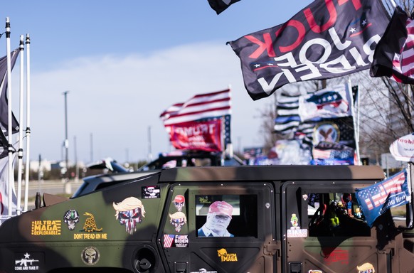epa10554750 A military-style Humvee belonging to a supporter of former President Donald J. Trump is seen at a rally in support of Trump outside of an event with Florida Governor Ron DeSantis in Garden ...