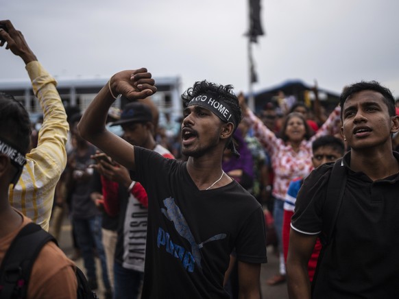 Protesters shout slogans at the protest site in Colombo, Sri Lanka, Monday, July 11, 2022. Sri Lanka is in a political vacuum for a second day Monday with opposition leaders yet to agree on who should ...