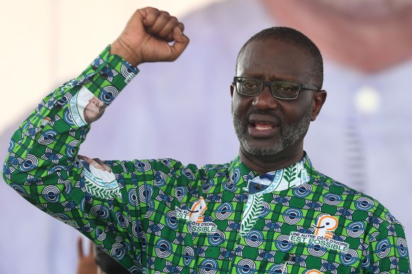 epa11898504 President of the Democratic Party of Ivory Coast (PDCI) Tidjane Thiam gestures during a mobilization meeting for the presidential election in Yopougon, a popular commune in Abidjan, Ivory  ...
