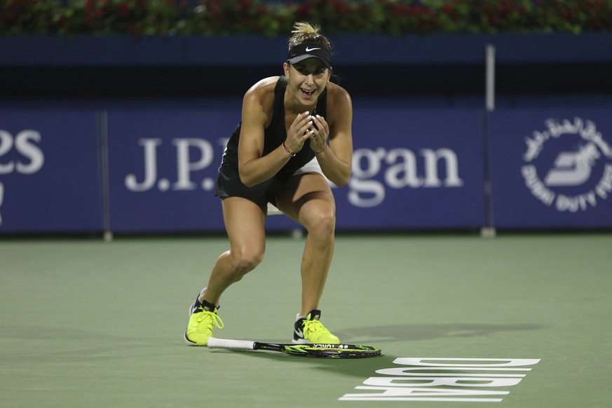 Switzerland&#039;s Belinda Bencic celebrates after defeating Czech Republic&#039;s Petra Kvitova during their final match of the Dubai Duty Free Tennis Championship in Dubai, United Arab Emirates, Sat ...