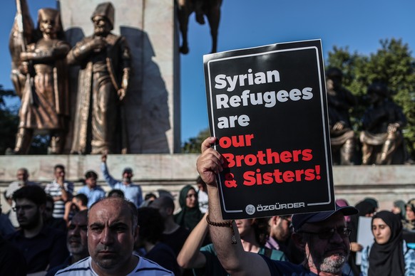 epa07744804 Members of some Turkish Islamist NGOs gather to protest against the Turkish government's recent refugee action, during a demonstration in Istanbul, Turkey, 27 July 2019. Turkey's ...