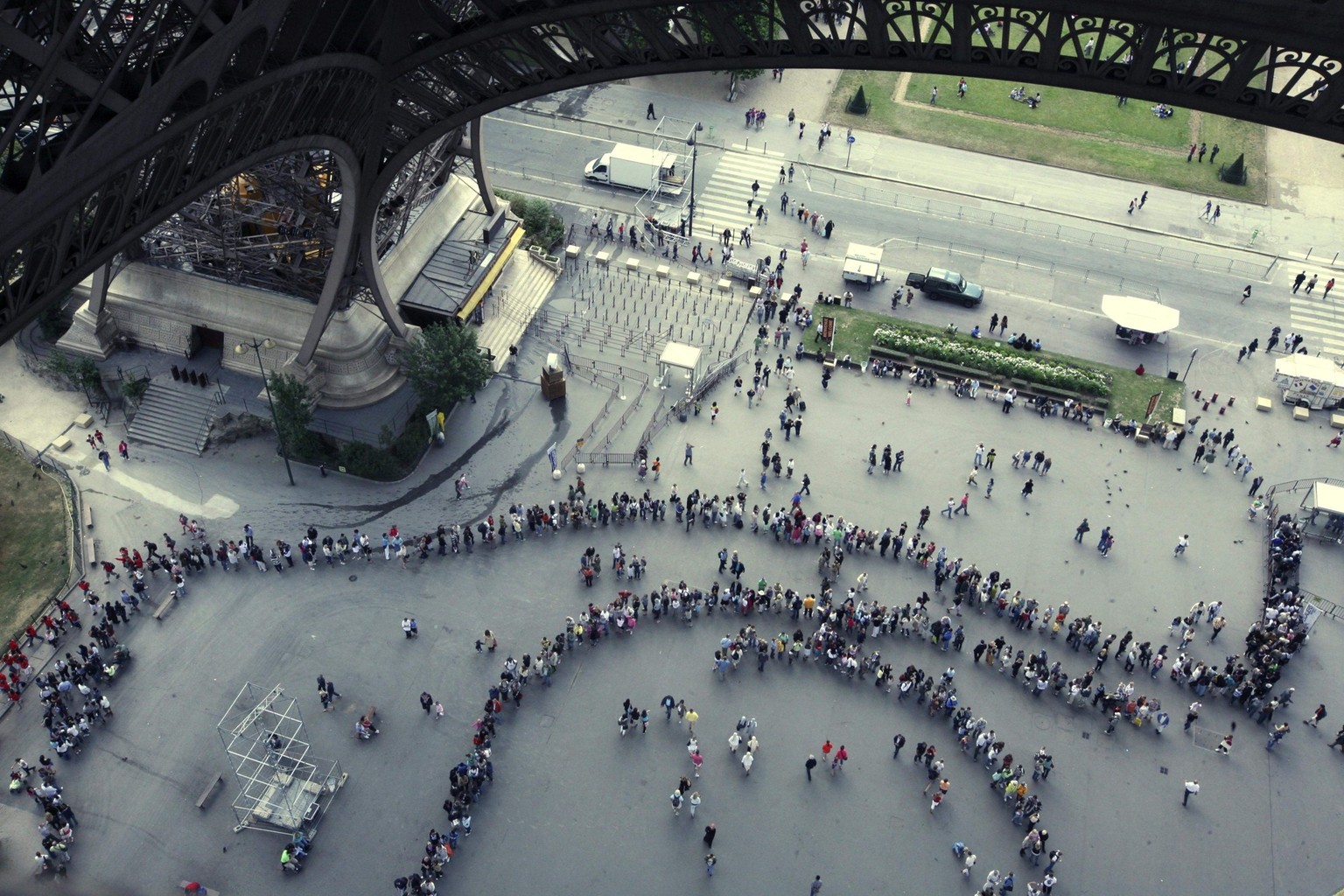 Visitors queue to enter the Eiffel Tower, Wednesday July 9, 2008 in Paris. The Eiffel Tower, which sees nearly 7 million visitors per year, has just about reached its limits in terms of capacity. So n ...